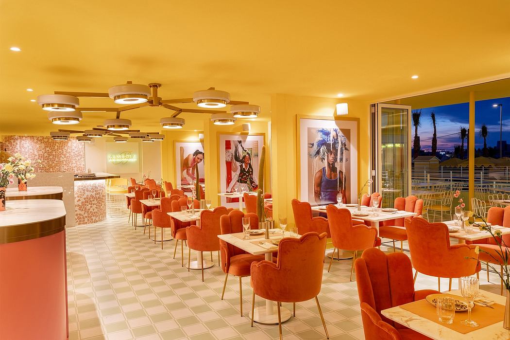 Vibrant, modern restaurant interior with geometric lighting, patterned tiles, and plush orange chairs.