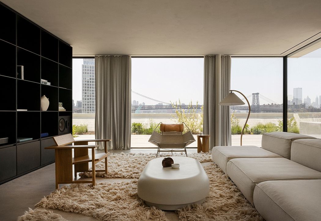 Stunning modern living room with floor-to-ceiling windows, plush furnishings, and cityscape view.