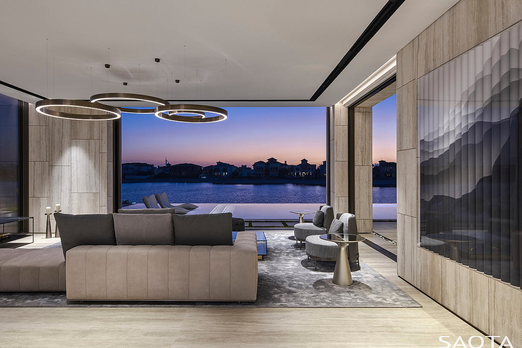 Luxurious living space with stunning waterfront view and modern architectural features.