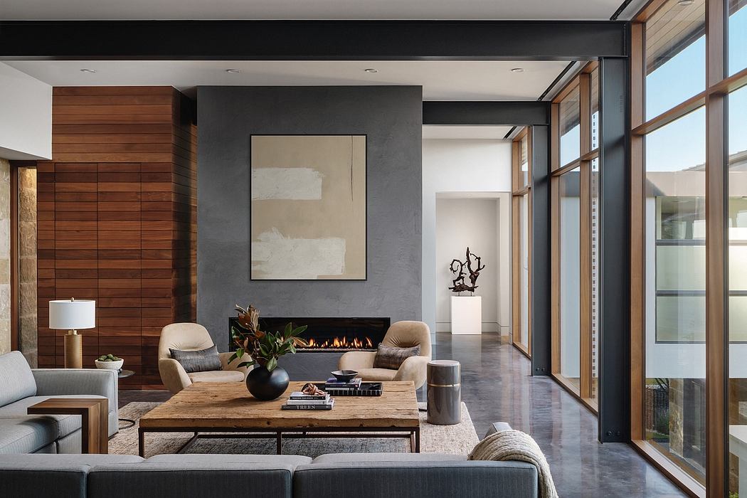 Spacious living room with wood paneling, fireplace, and modern furniture.
