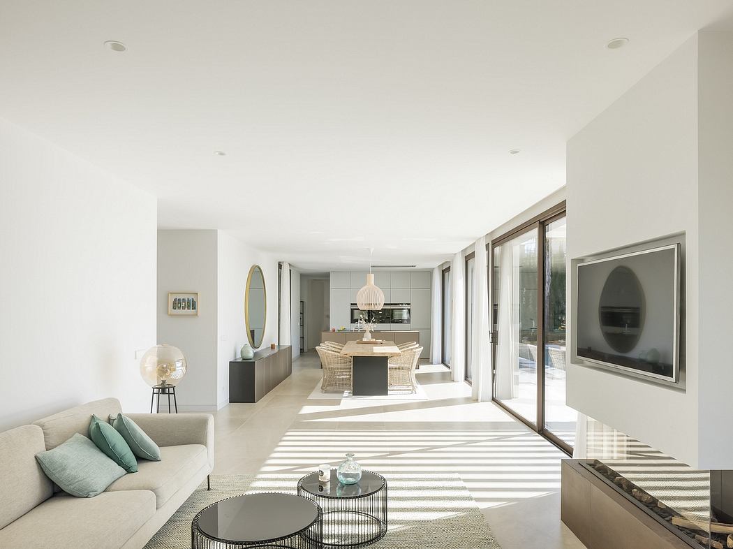 Bright, open-concept living space with sleek, modern furnishings and large windows.