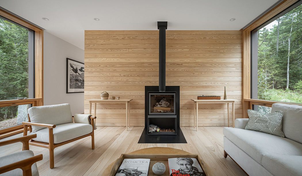 Cozy log cabin interior with sleek fireplace, wood-paneled walls, and modern furnishings.