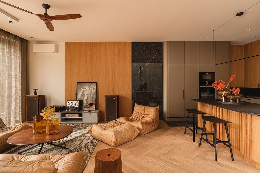 A modern, warm-toned interior with wood paneling, sleek cabinets, and plush seating.