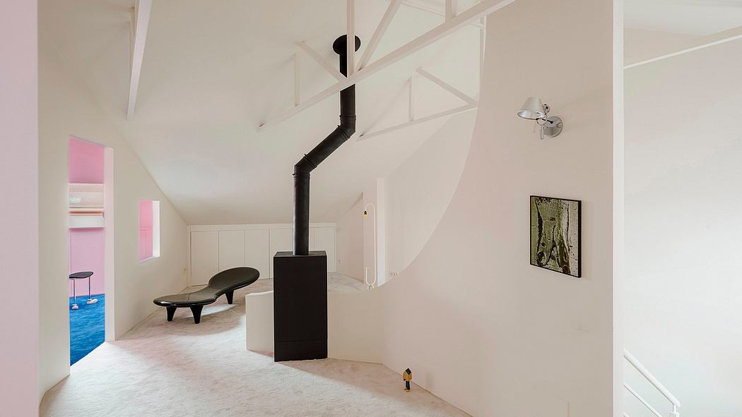 Minimalist interior with sloped ceiling, exposed beams, and modern furniture elements.