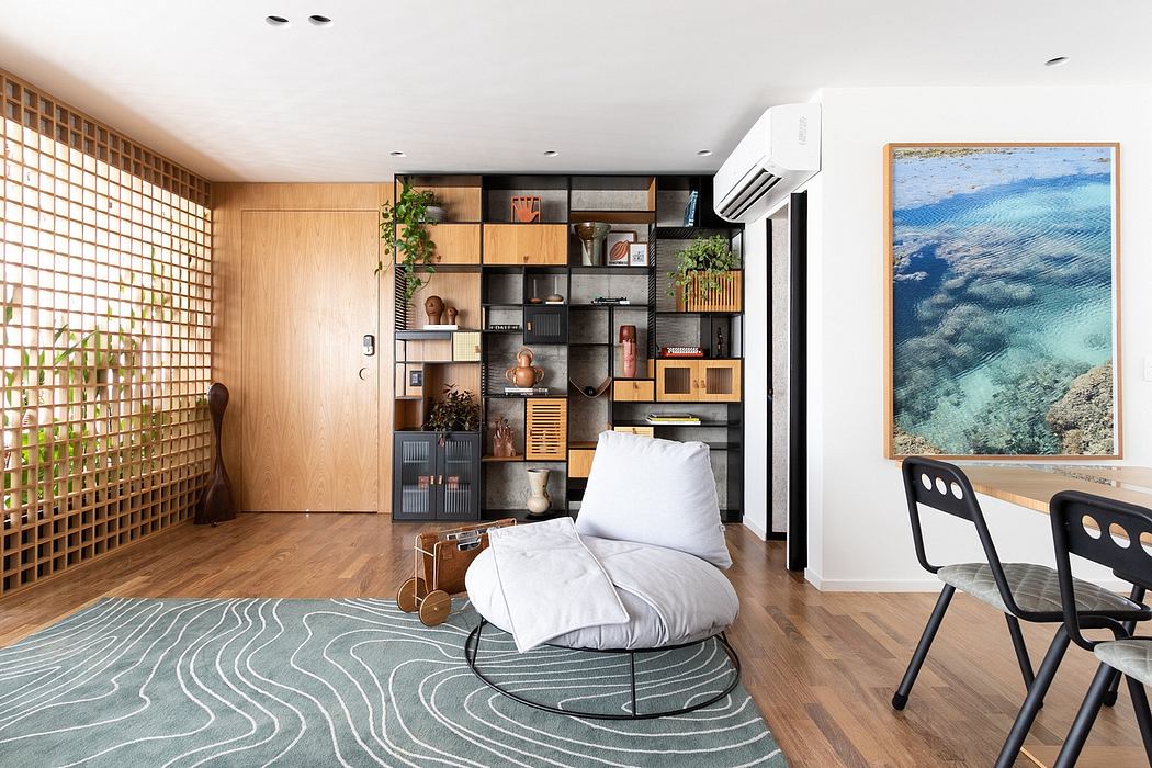 Cozy apartment with wooden accents, built-in shelving, and a serene seascape painting.