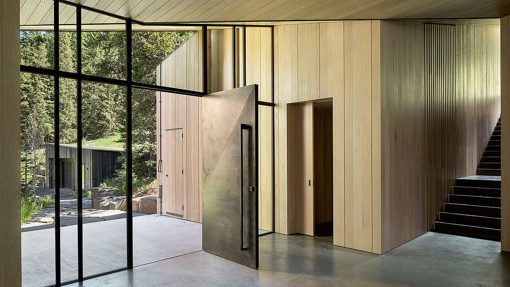 Minimalist interior with wooden walls, glass windows, and a modern open layout.