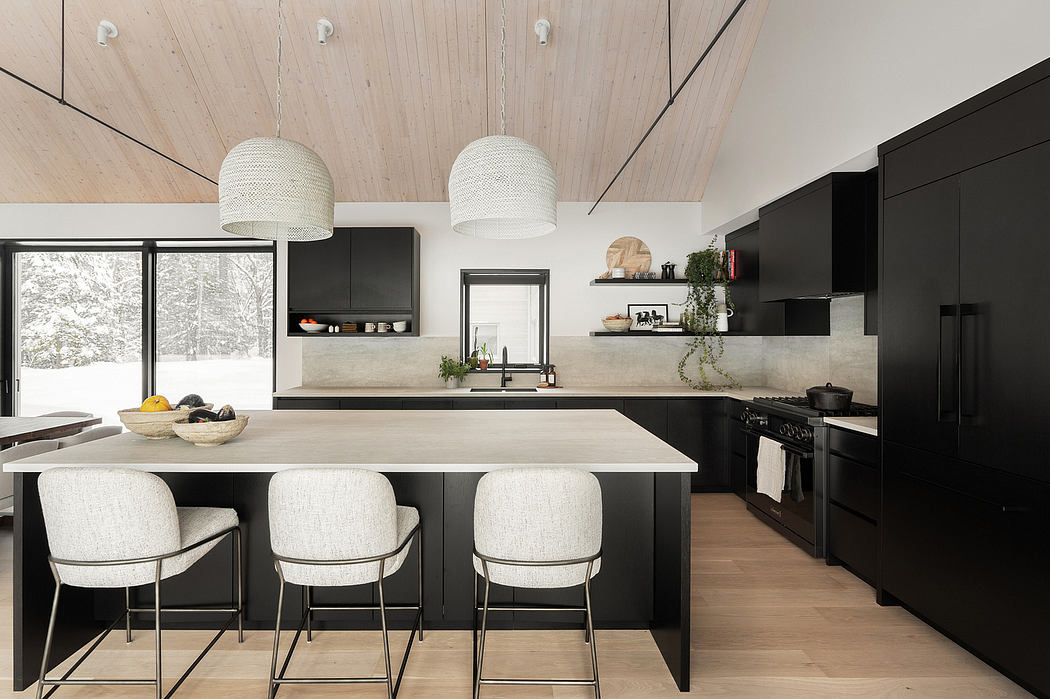 Sleek, modern kitchen with black cabinetry, concrete counters, and woven pendant lights.