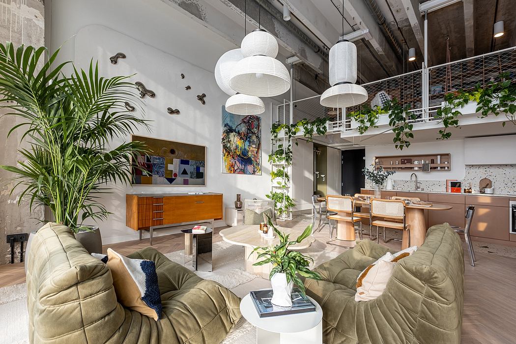 Spacious open-concept living area featuring lush greenery, modern lighting, and eclectic decor.