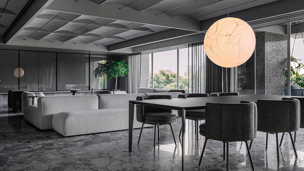 Sophisticated modern interior with geometric ceiling, plush sofa, and statement lighting.