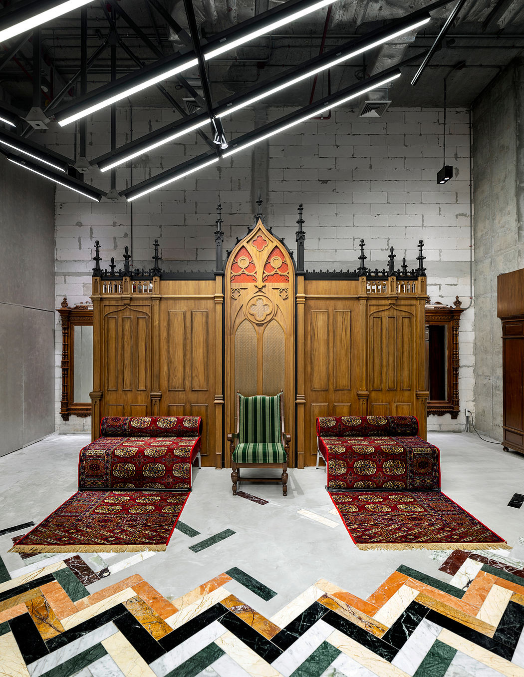 Ornate wooden furnishings, intricate tile flooring, and dramatic lighting create a striking ecclesiastical atmosphere.