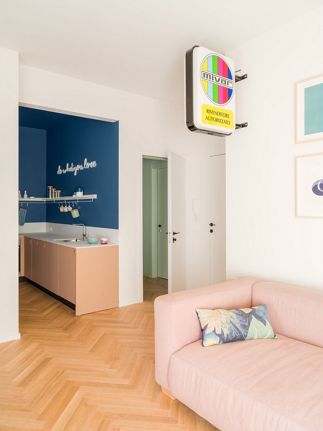 Cozy apartment with vibrant color palette, modern furnishings, and eye-catching TV display.
