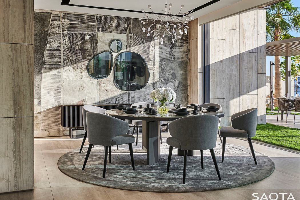 Striking modern dining area with sculptural chandelier, textured walls, and sleek furnishings.