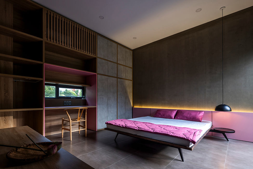 Minimalist bedroom with dark accent walls, built-in shelves, and a low platform bed.
