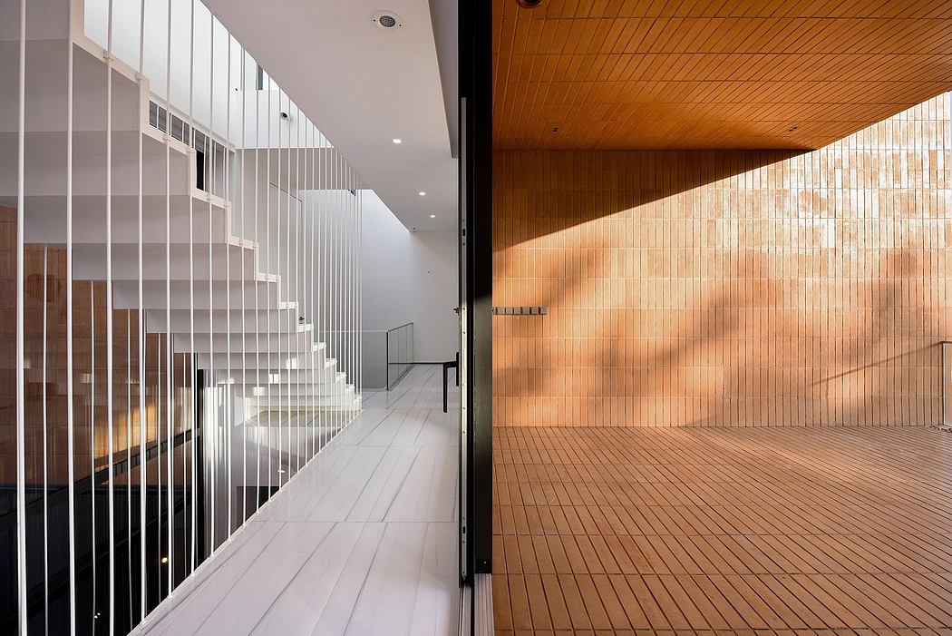 Elegant modern corridor with sleek partitions and warm wooden accents.