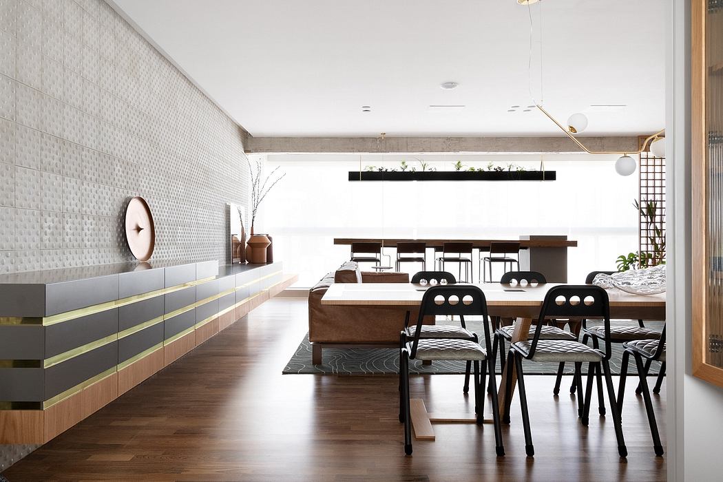Spacious, modern interior with geometric wall tiles, wooden furniture, and minimalist decor.