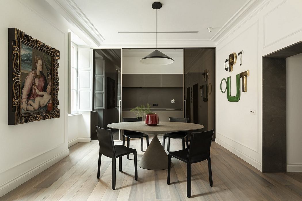 Elegant dining room with modern furnishings, ornate painting, and sleek lighting fixture.