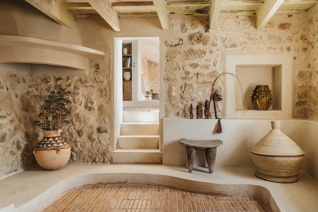 Rustic stone walls, beamed ceilings, and earthy decor elements create a warm, inviting atmosphere.