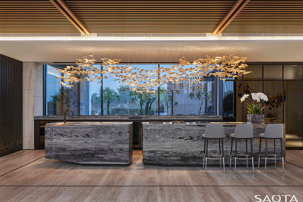 Elegant lobby with striking pendant lighting, stone bar, and modern furniture.