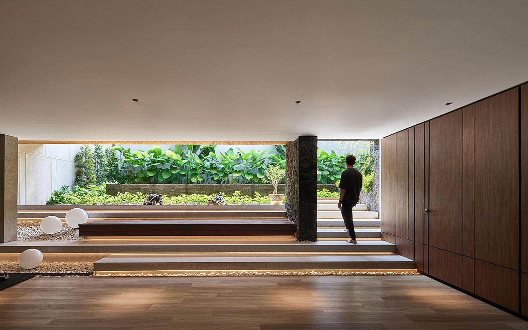 A well-designed indoor garden with wooden steps, wall panels, and lush greenery.