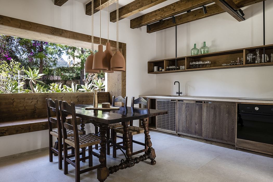 Rustic, open-concept kitchen with exposed wooden beams, shelving, and pendant lights.
