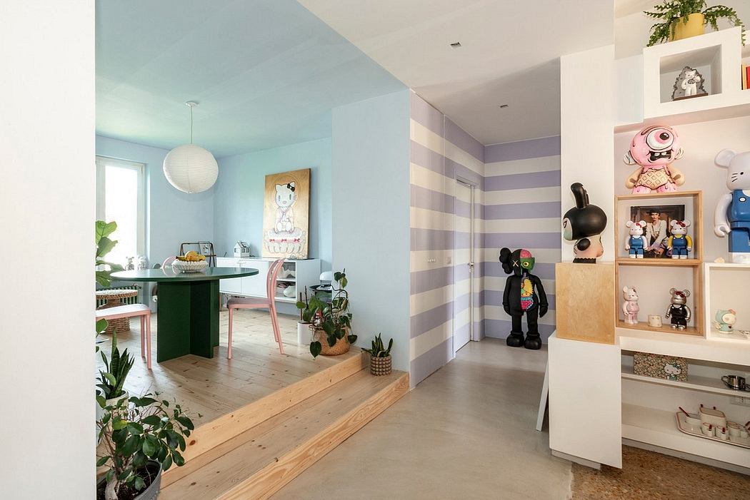 Modern, playful interior with striped walls, wood floors, and eclectic decor.