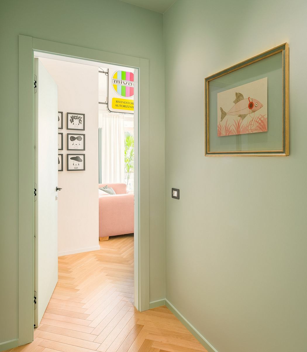 Pastel-colored entryway with geometric wall art and a framed fish painting.