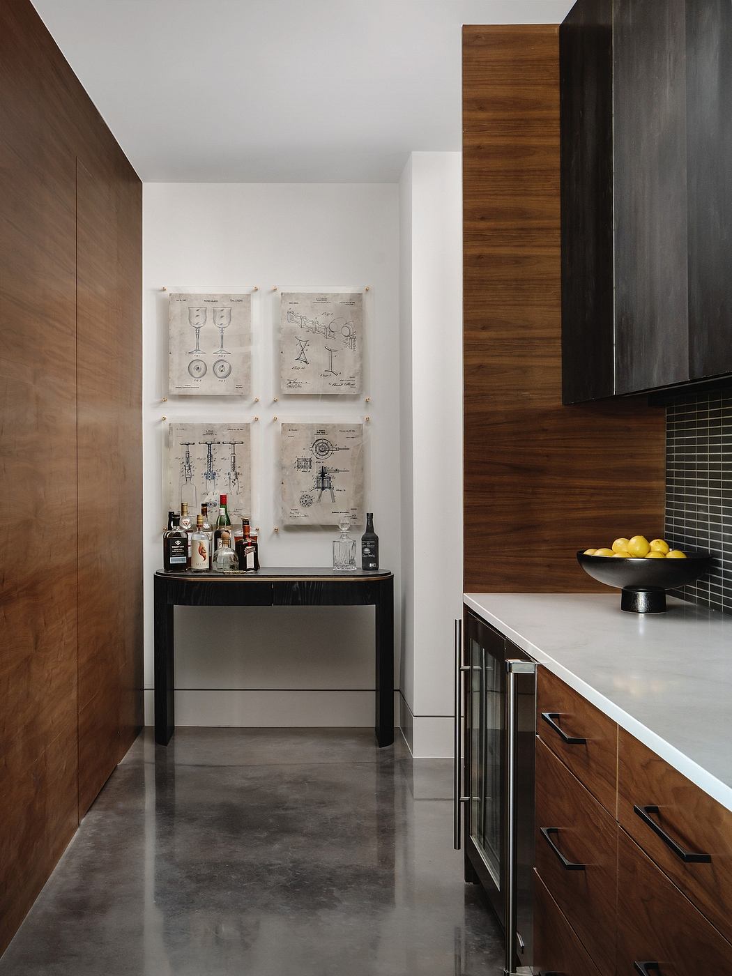 Modern kitchen design showcases wooden cabinetry, patent artwork, and a contemporary bar setup.