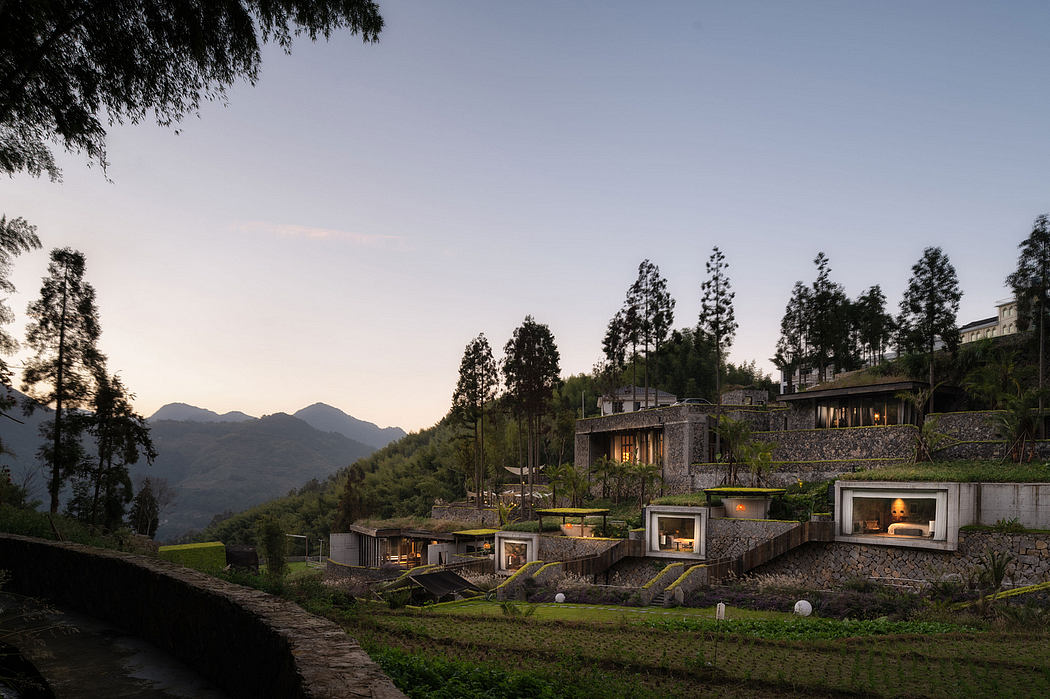Mountainside resort with modern, eco-friendly architecture blending into landscape.