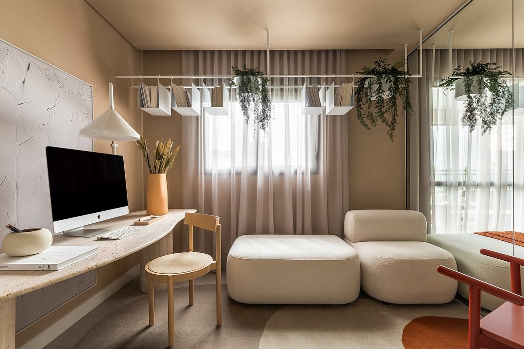 Cozy home office with beige sofas, hanging plants, and a minimalist desk setup.