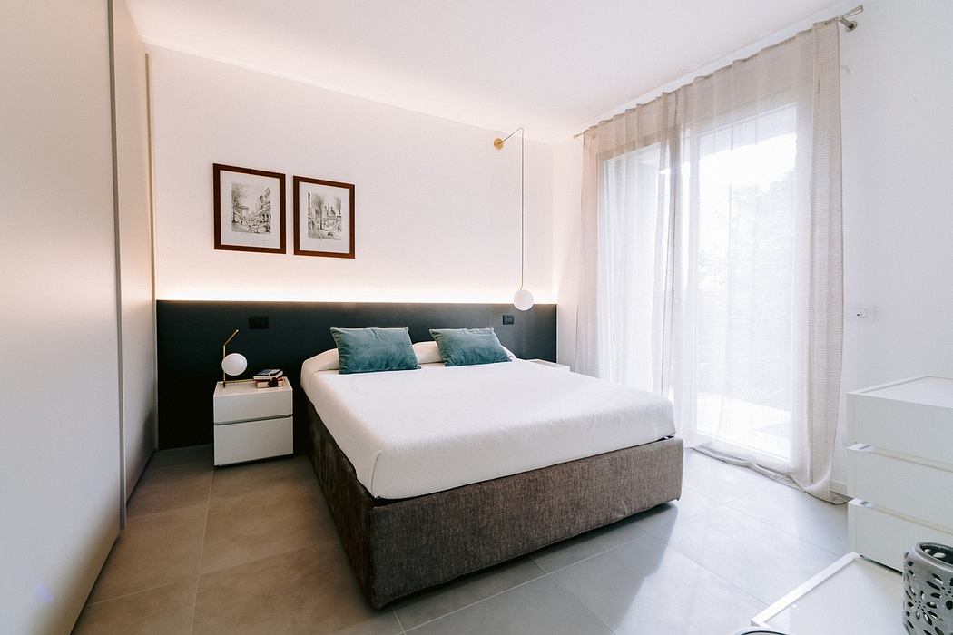 Serene bedroom interior with plush bedding, minimalist furniture, and elegant wall art.