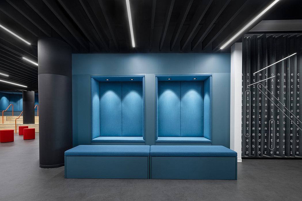 A modern, minimalist interior design with two blue upholstered benches and sleek lighting.