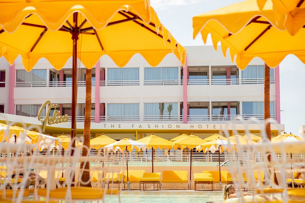 Vibrant yellow umbrellas and midcentury modern architecture at the Fashion Hotel.