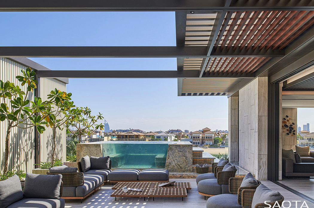Modern design with open-air living space, pool, and panoramic city views.