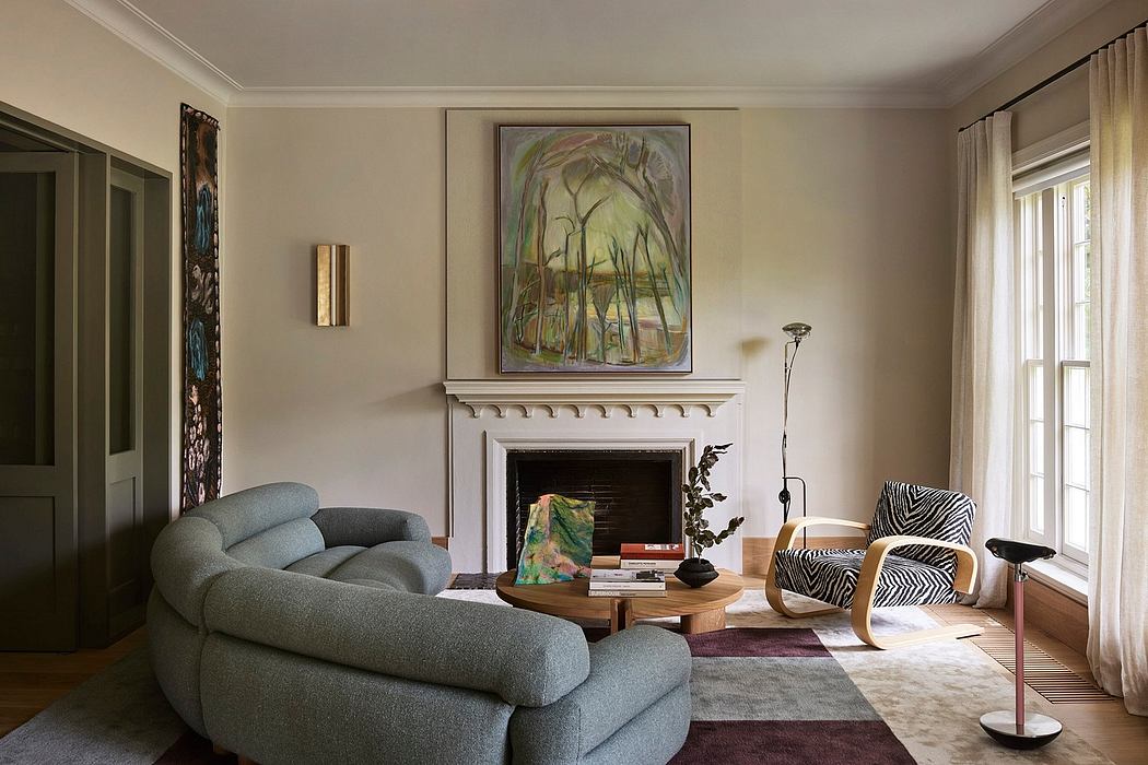 Elegant living room with ornate fireplace, plush furnishings, and vibrant artwork.