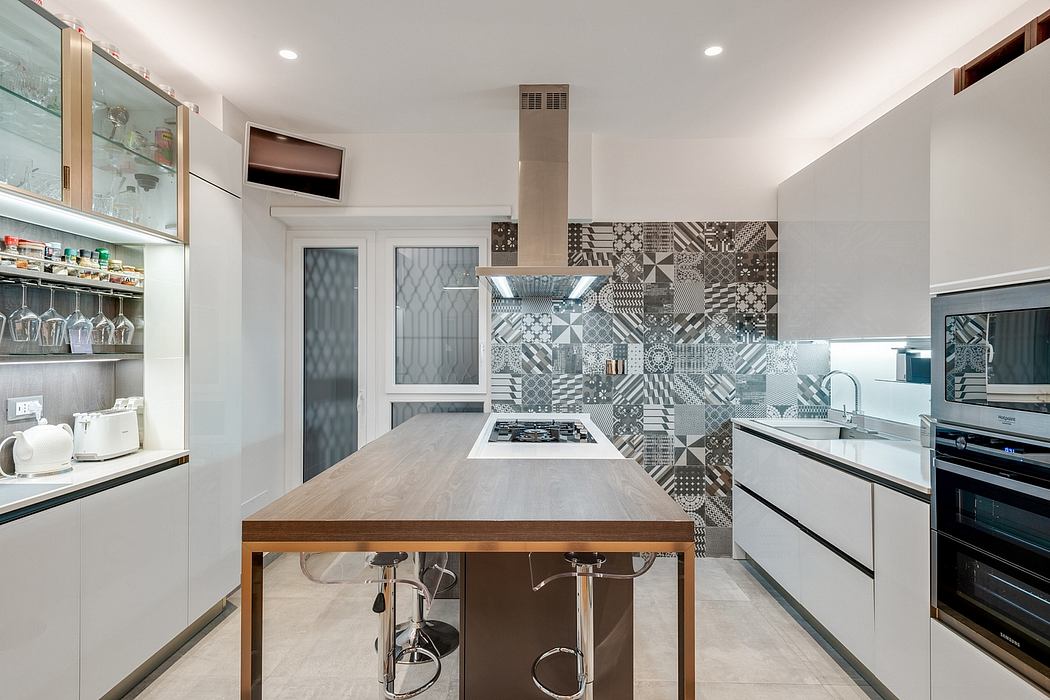 Modern, sleek kitchen with patterned tile backsplash, wooden table, and stainless steel appliances.
