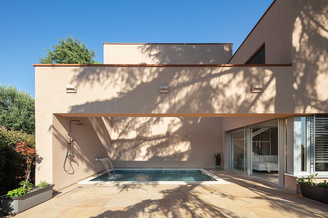 Modern architectural design with sleek lines, an inviting pool, and stylish outdoor lighting.