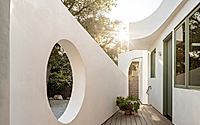 010-moon-gate-adu-frames-primary-house-with-cheerful-geometries.jpg