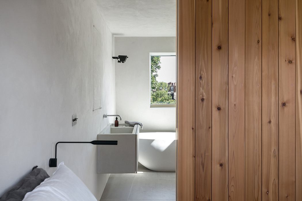 Minimalist bathroom design with white walls, wooden paneling, and a modern vanity.