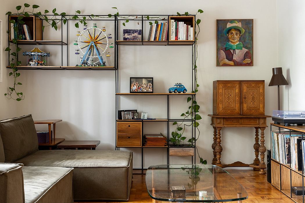 Cozy living space with eclectic furniture, shelving, and plant decor. Inviting ambiance.