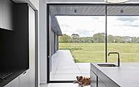 010-weald-house-mirrors-remote-kent-meadows-with-sleek-roof-tiles.jpg