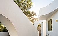 011-moon-gate-adu-frames-primary-house-with-cheerful-geometries.jpg