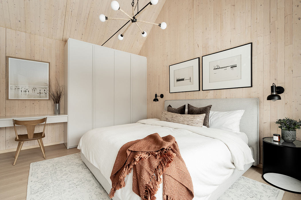 Cozy bedroom with rustic wood paneling, sleek built-in closets, and modern lighting fixture.