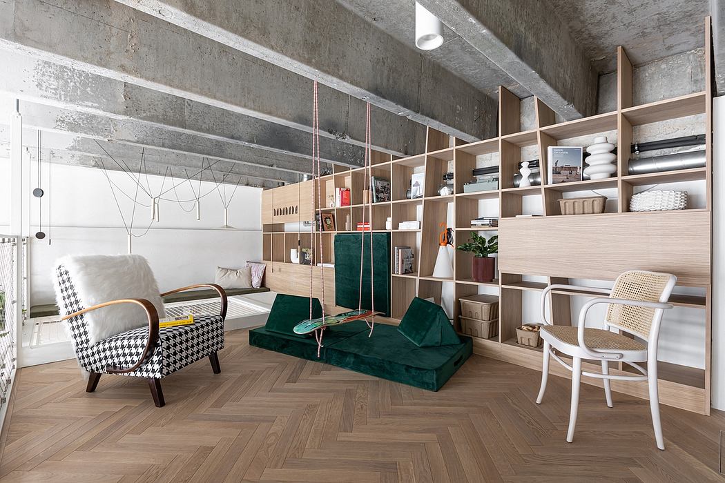 A modern, minimalist room with exposed concrete walls, modular shelving, and plush green furnishings.