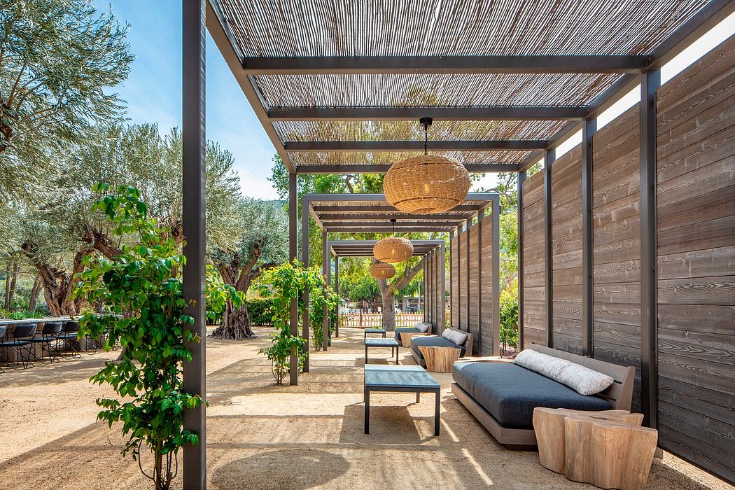 Rustic outdoor patio with woven shade structures, wooden furnishings, and decorative lighting.