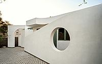013-moon-gate-adu-frames-primary-house-with-cheerful-geometries.jpg
