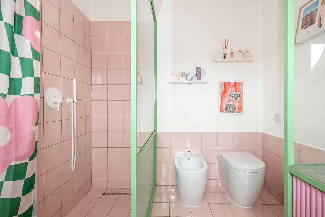 Colorful, retro-inspired bathroom with pink and green tiles, a shower curtain, and shelving.