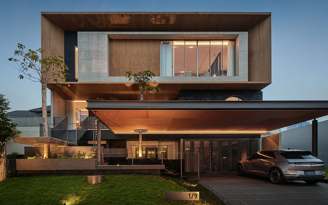 Striking modern home with wooden facade, expansive glass, and cantilevered design.