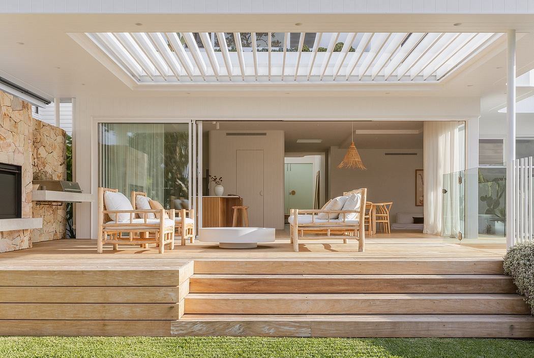 Spacious open-concept patio with wooden floors, comfortable seating, and natural light.