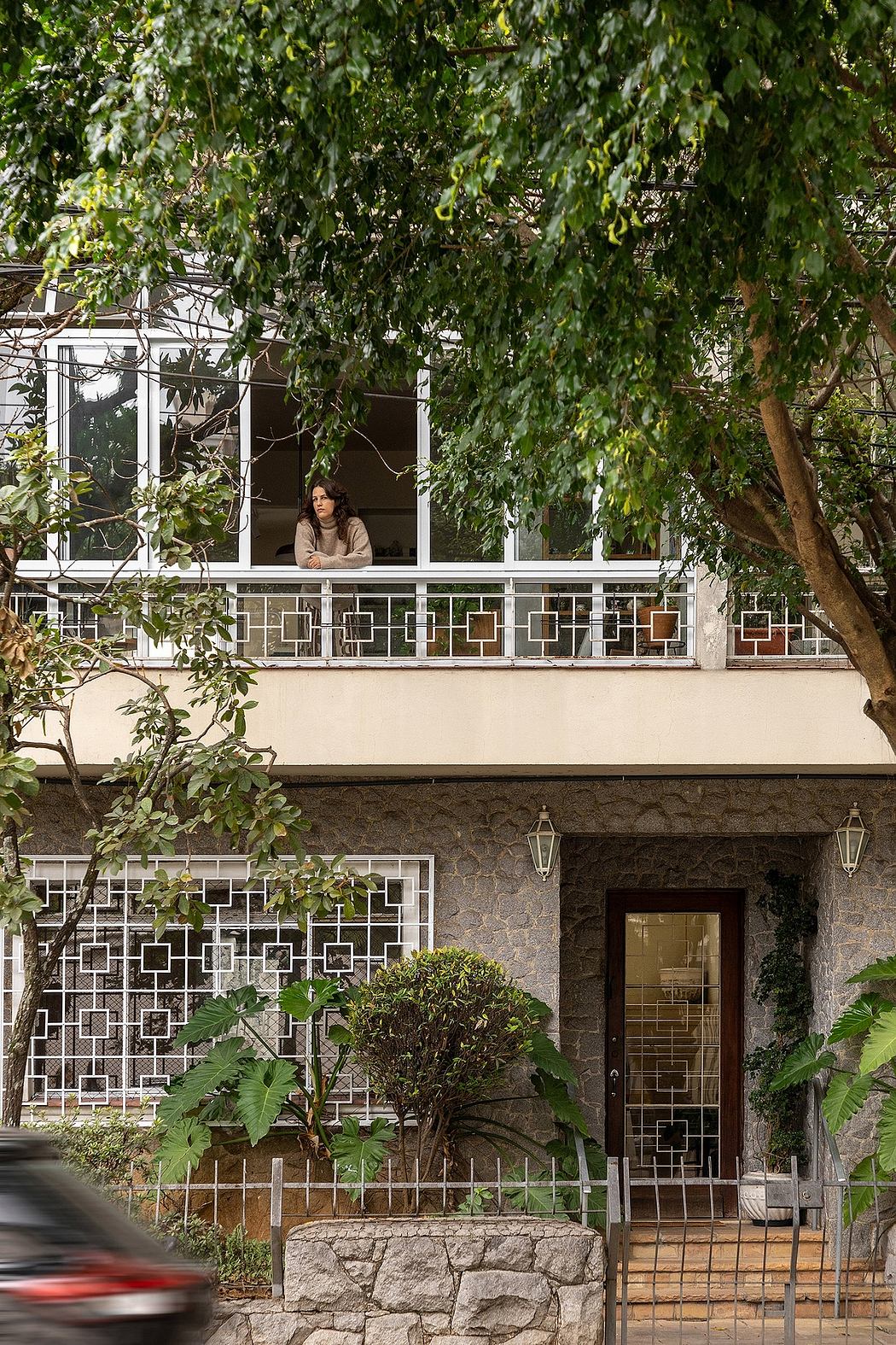 An architectural masterpiece with intricate latticed windows and lush foliage, creating a serene oasis.