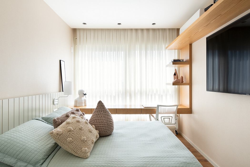 Minimalist bedroom with neutral colors, wood accents, and built-in shelving.